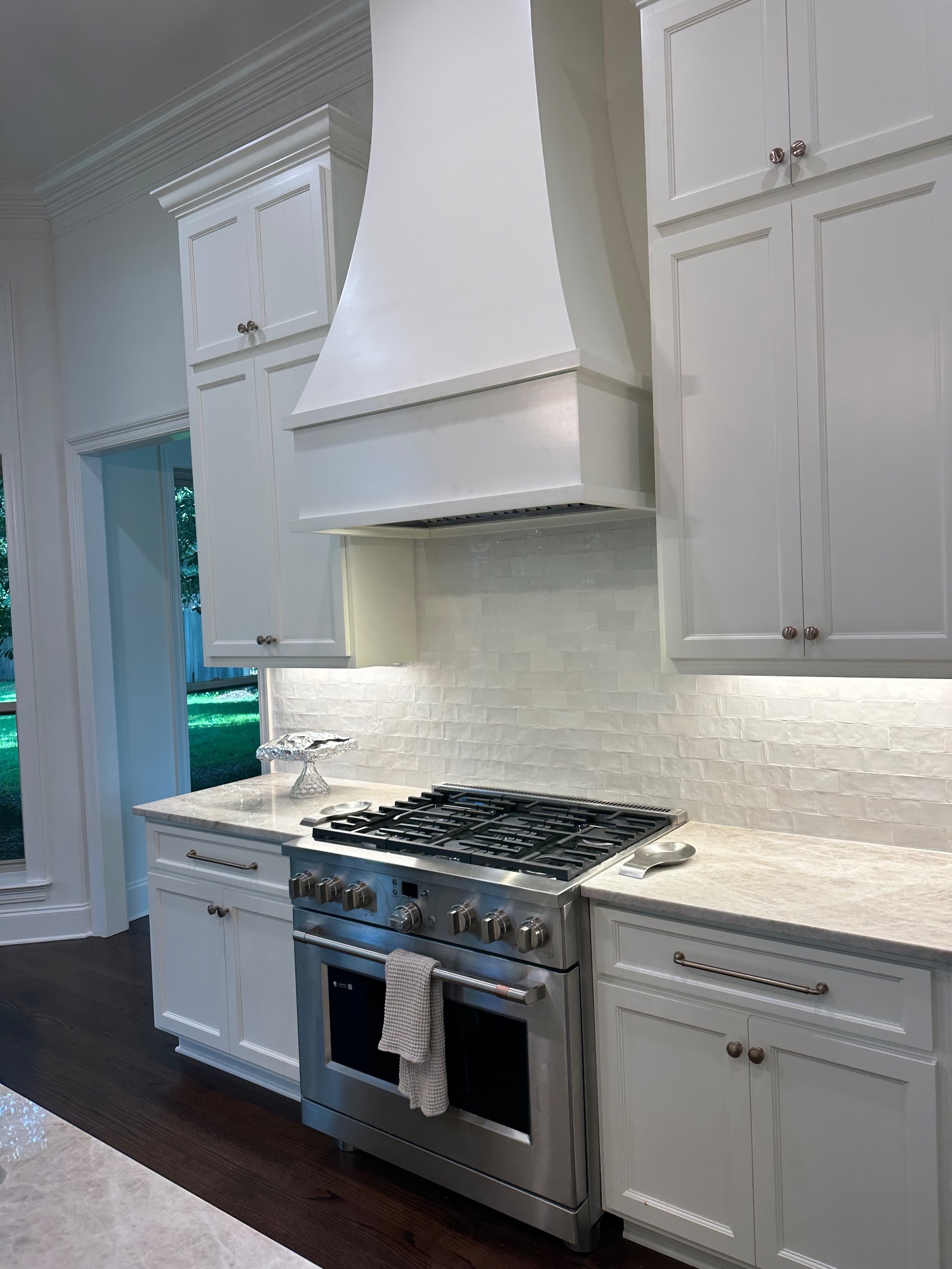 Luxury kitchen with custom cabinetry and marble countertops