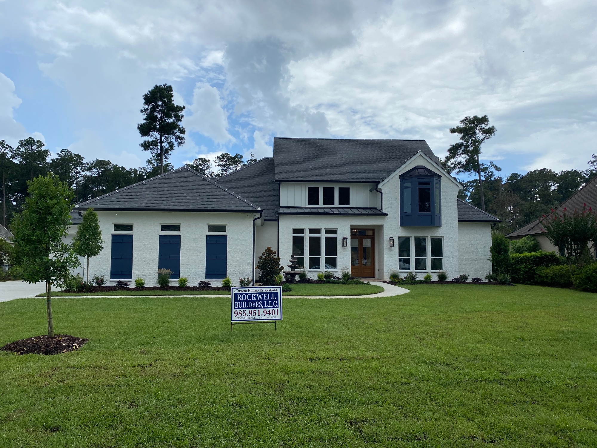Modern white luxury home with blue accents